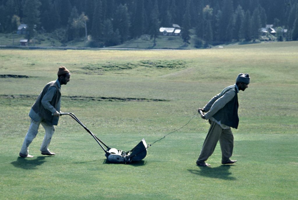 Unusual lawn mower requiring two men.