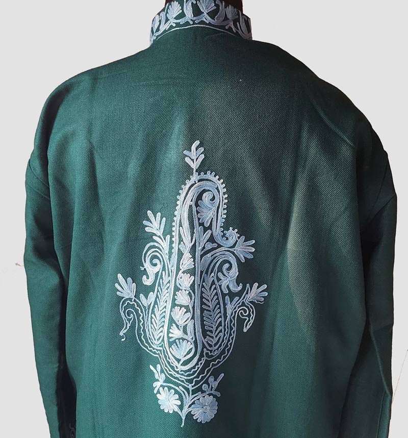 blue emoroidery on green coat